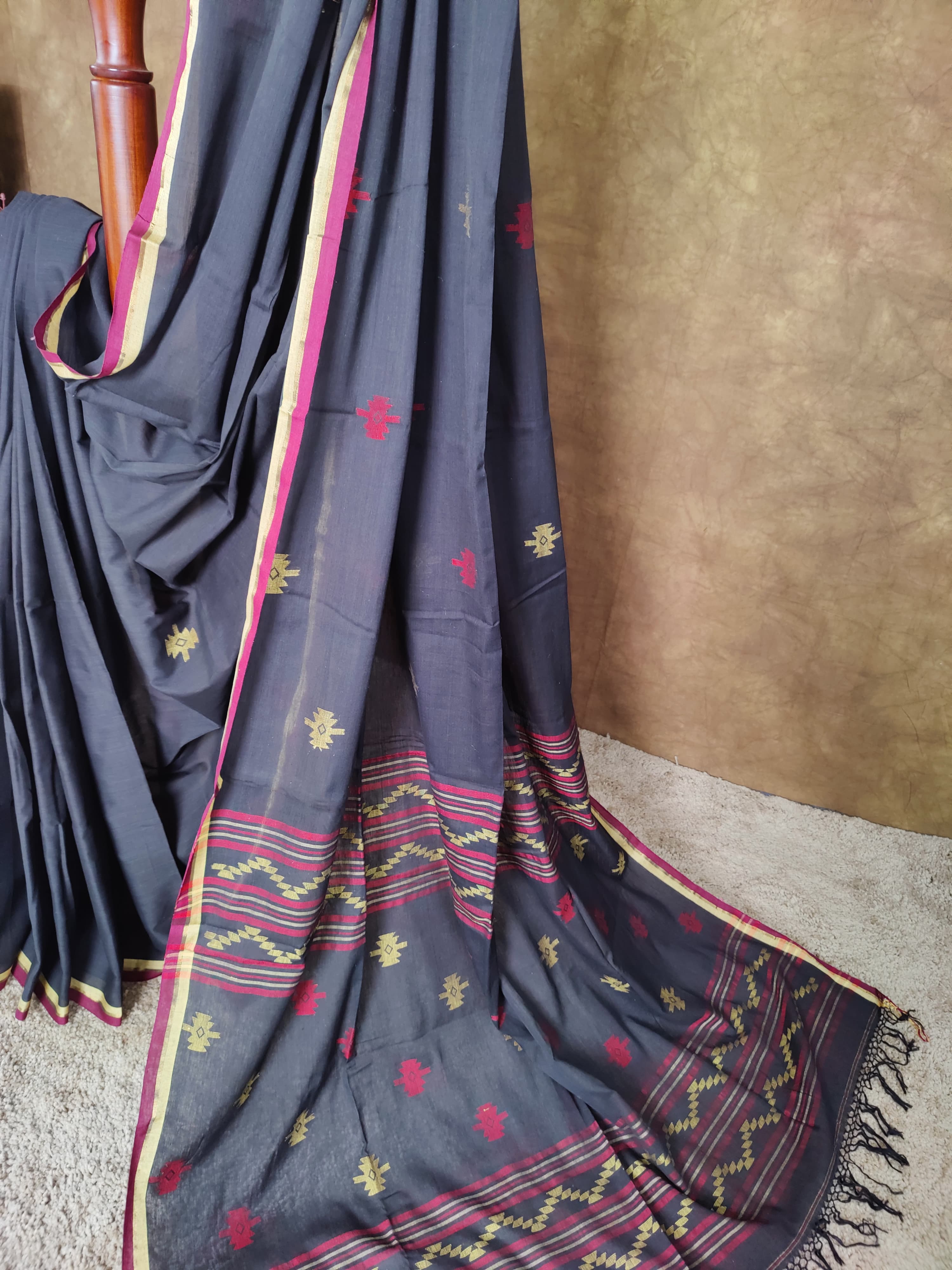 Black cotton Jamdani saree with red and yellow motifs