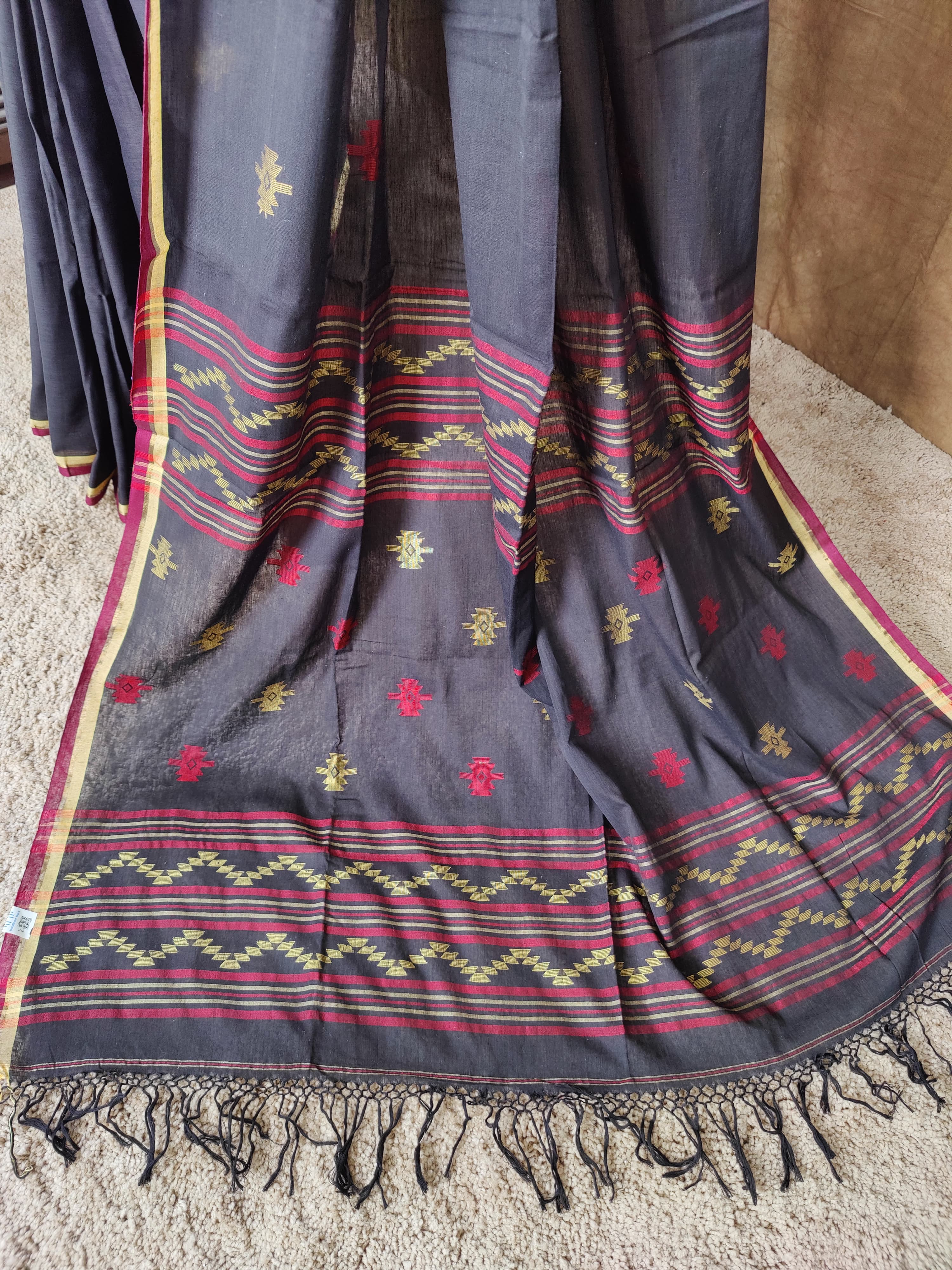 Black cotton Jamdani saree with red and yellow motifs