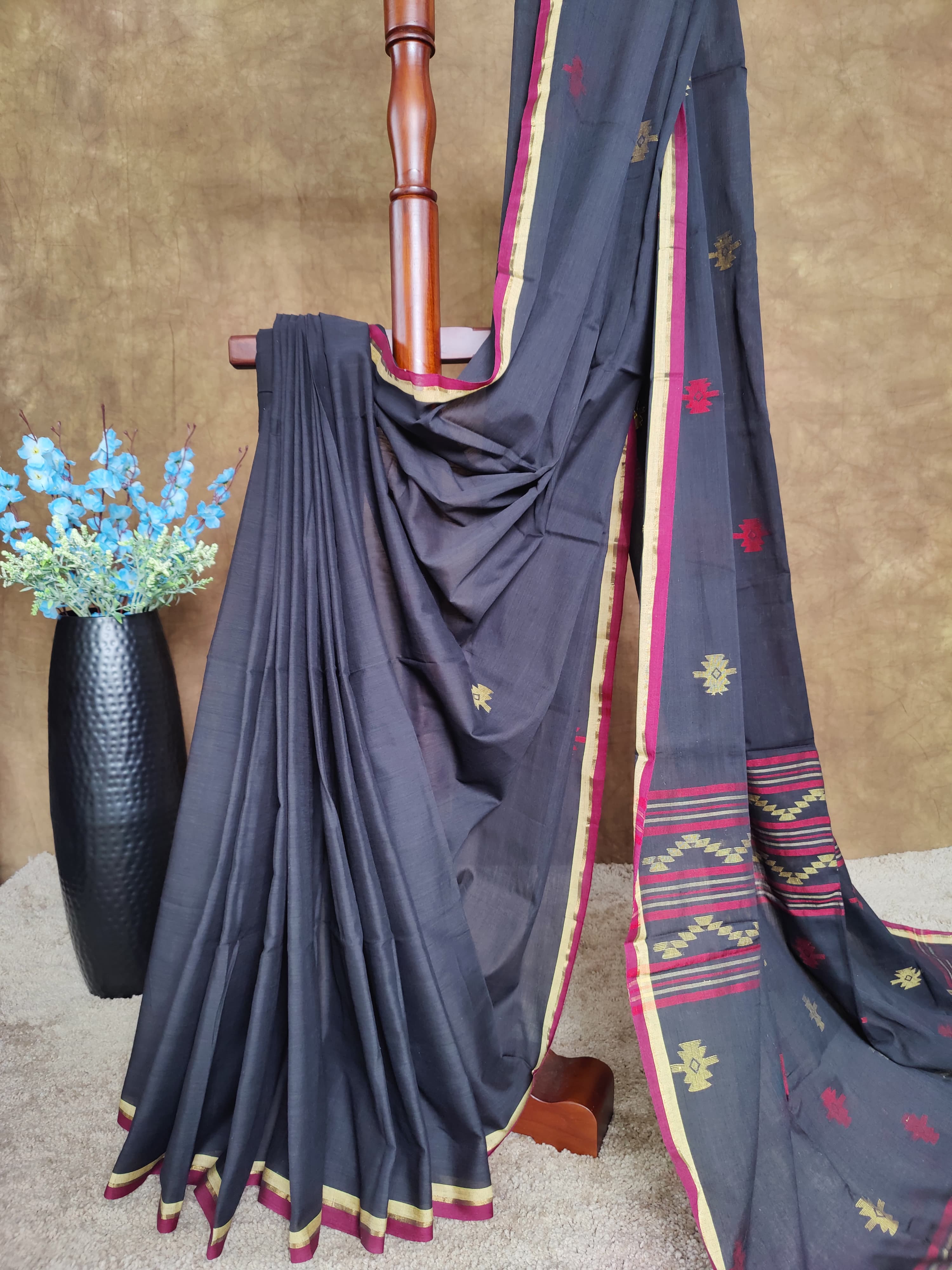 Black cotton Jamdani saree with red and yellow motifs