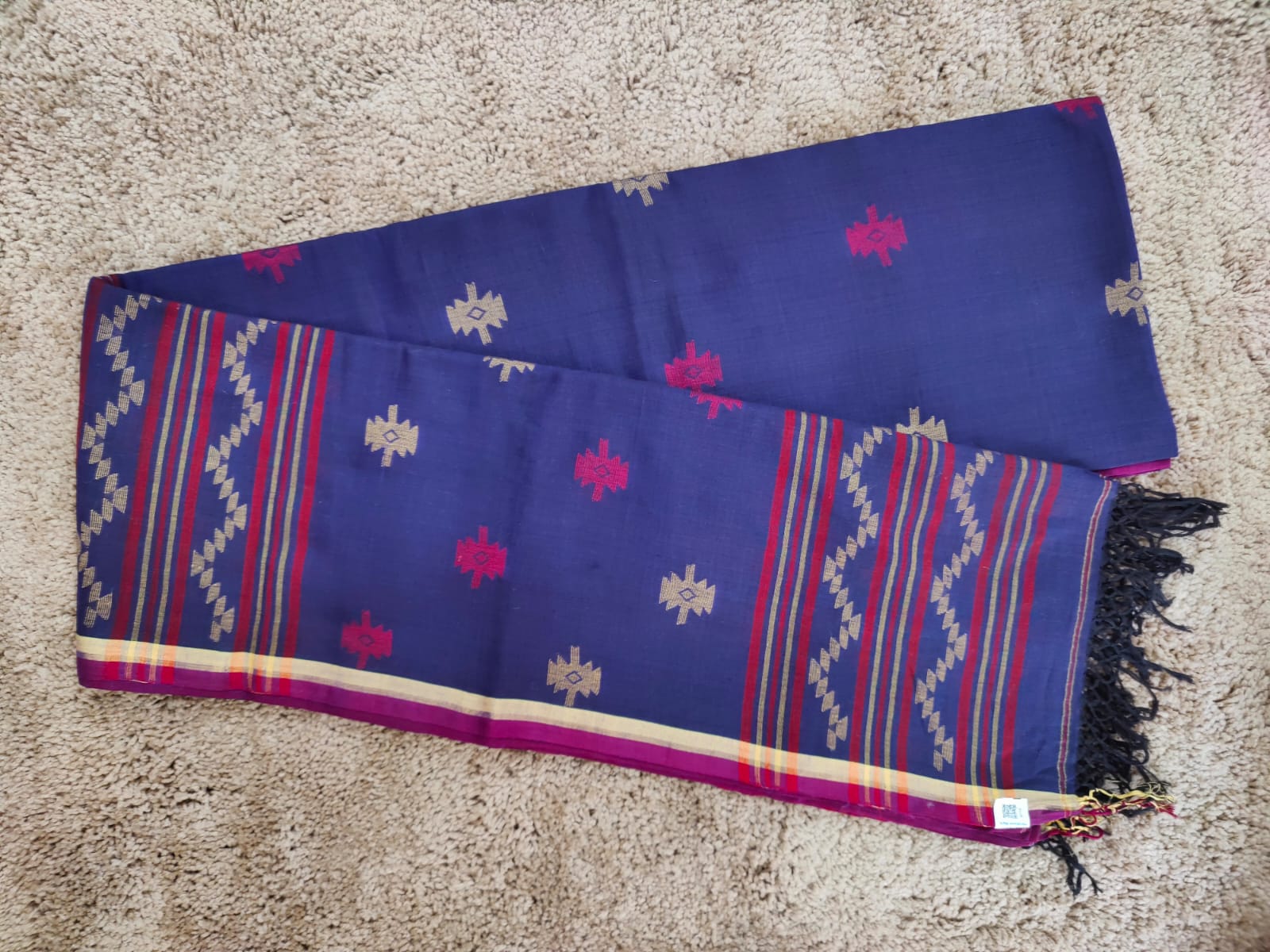 Blue cotton Jamdani saree with red and yellow motifs