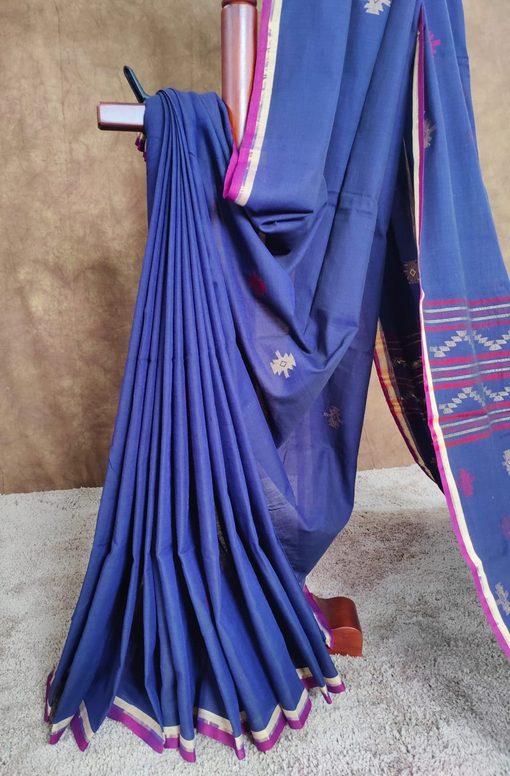 Blue cotton Jamdani saree with red and yellow motifs