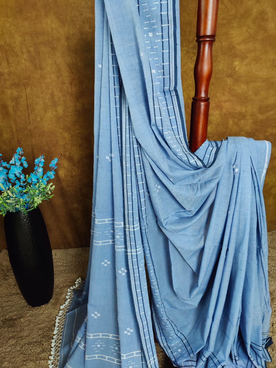 Sky blue cotton Jamdani saree with navy blue border