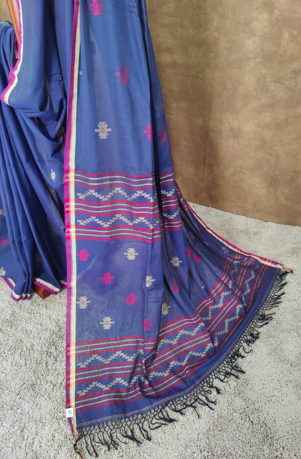 Blue cotton Jamdani saree with red and yellow motifs