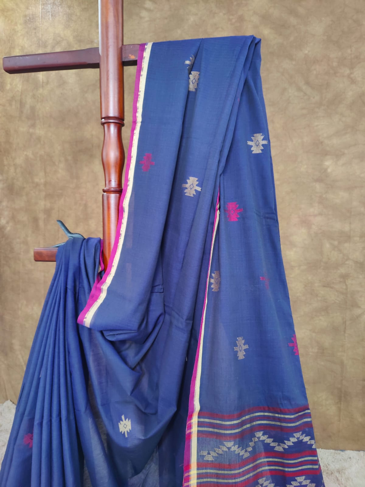 Blue cotton Jamdani saree with red and yellow motifs
